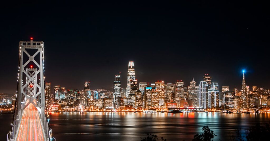 Stunning view of San Francisco skyline and Bay Bridge illuminated at night.